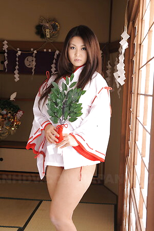 Hot Airi Ai in short kimono shows huge boobs tied in a red rope.